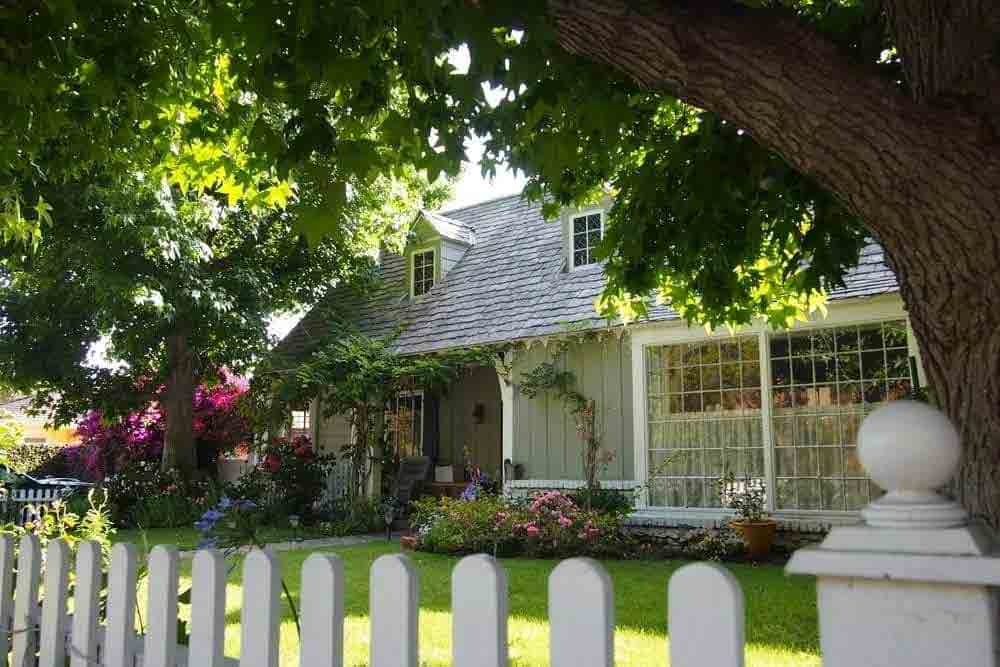 a house with a white picket fence