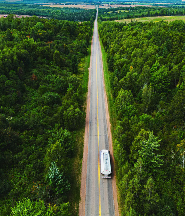 aerial view of a home heating oil truck on a rural backroad